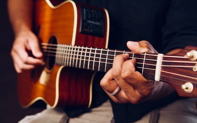 person playing the guitar