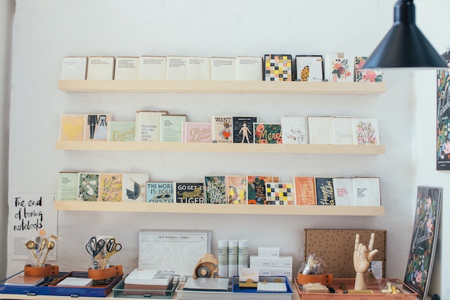 inside of art store with prints and shelves