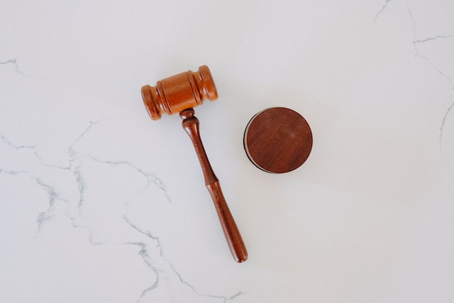 brown gavel on marble backdrop