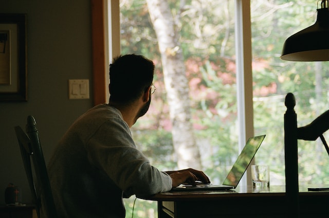 man sitting in front of computer